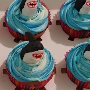 Shark jumping from a cupcake